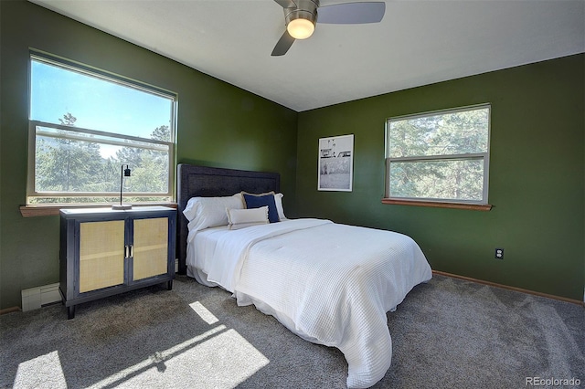 28051 Camel Heights Cir, Evergreen, CO 80439 - carpeted bedroom with baseboards and ceiling fan