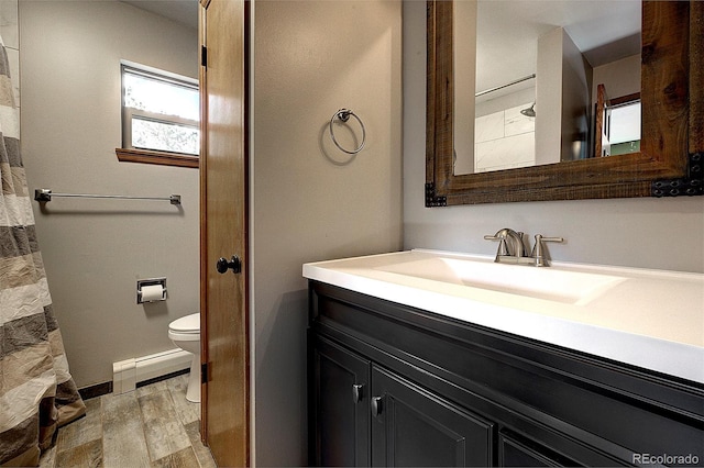 28051 Camel Heights Cir, Evergreen, CO 80439 - full bathroom featuring vanity, wood finished floors, and a baseboard radiator