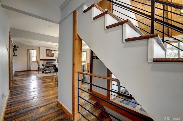 28051 Camel Heights Cir, Evergreen, CO 80439 - stairway with wood finished floors and baseboards