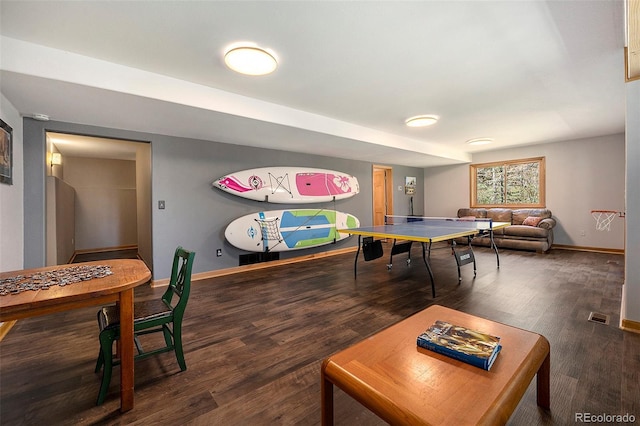 playroom with baseboards and wood finished floors