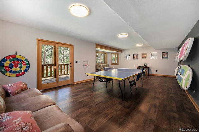recreation room with wood finished floors and baseboards