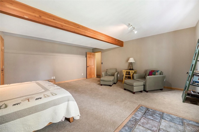carpeted bedroom featuring baseboards