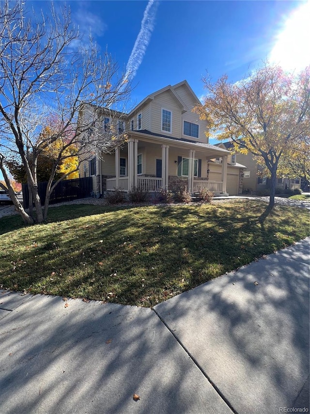 view of front of property featuring a front lawn and covered porch