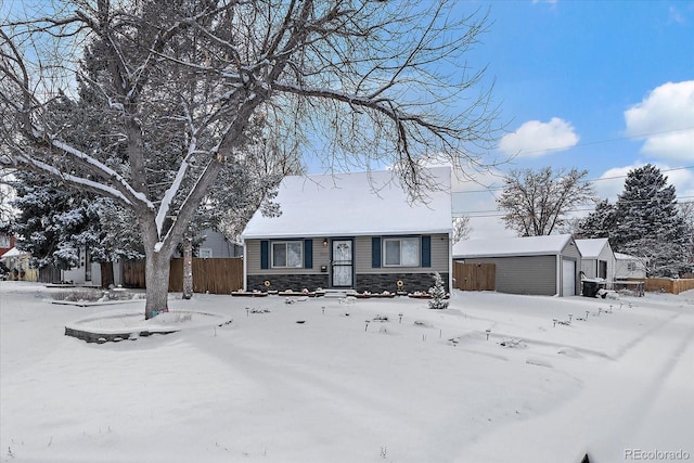 ranch-style house featuring an outbuilding and a garage