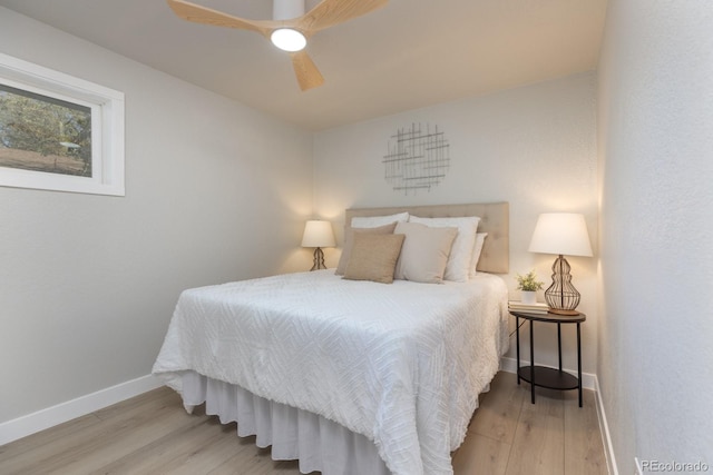 bedroom with wood-type flooring and ceiling fan