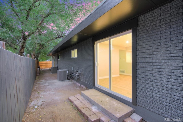 view of home's exterior featuring central AC unit and a patio area