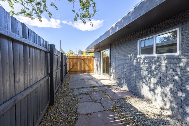 view of side of property with a patio