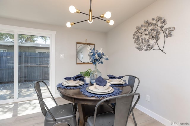 dining area featuring a notable chandelier