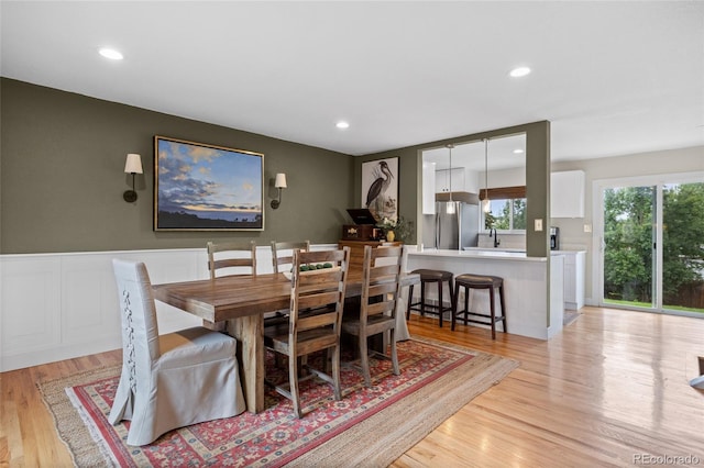 12705 W Chenango Ave, Morrison, CO 80465 - dining space with light wood finished floors and recessed lighting