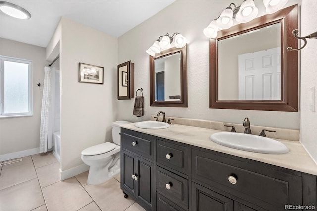 12705 W Chenango Ave, Morrison, CO 80465 - bathroom with double vanity, tile patterned flooring, and shower / tub combo