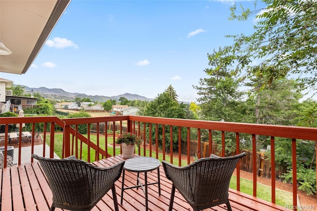12705 W Chenango Ave, Morrison, CO 80465 - wooden terrace featuring a mountain view and a fenced backyard
