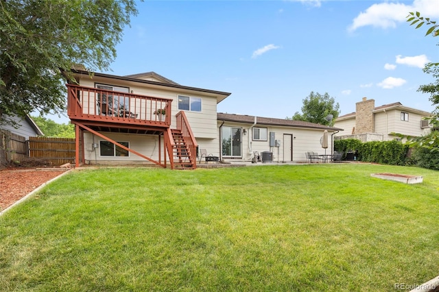 12705 W Chenango Ave, Morrison, CO 80465 - rear view of house featuring a wooden deck, a fenced backyard, stairs, and a patio