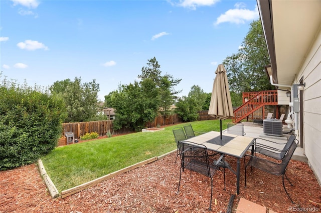12705 W Chenango Ave, Morrison, CO 80465 - fenced backyard with outdoor dining area and a patio
