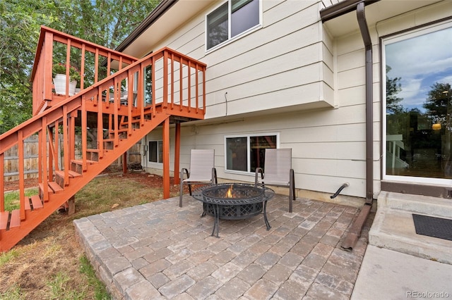 12705 W Chenango Ave, Morrison, CO 80465 - view of patio / terrace with stairs, a fire pit, and a deck