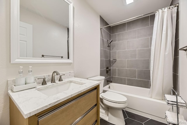 full bathroom with tile patterned floors, shower / bath combo, toilet, and vanity