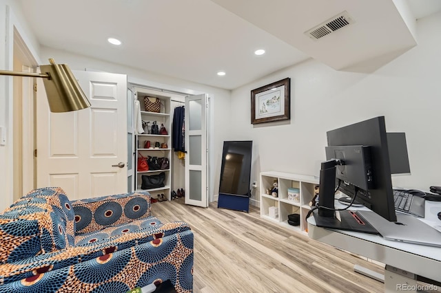 living area featuring wood finished floors and recessed lighting