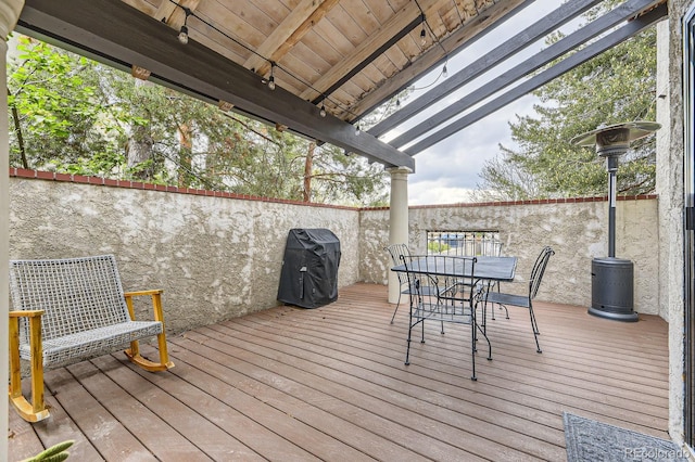 wooden deck with outdoor dining space