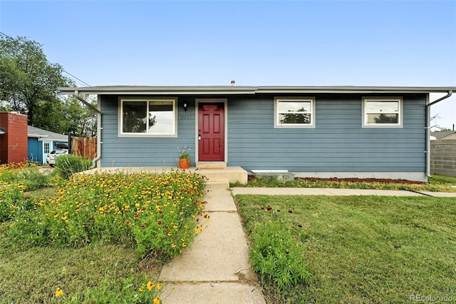 2011 S Vallejo St, Denver, CO 80223 - view of front facade with a front yard