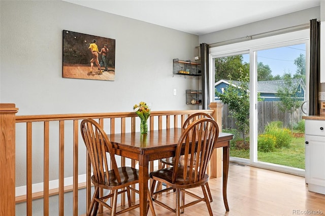 2011 S Vallejo St, Denver, CO 80223 - dining space featuring light wood-style floors