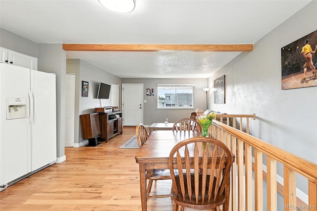 2011 S Vallejo St, Denver, CO 80223 - dining room with light wood-style floors and baseboards