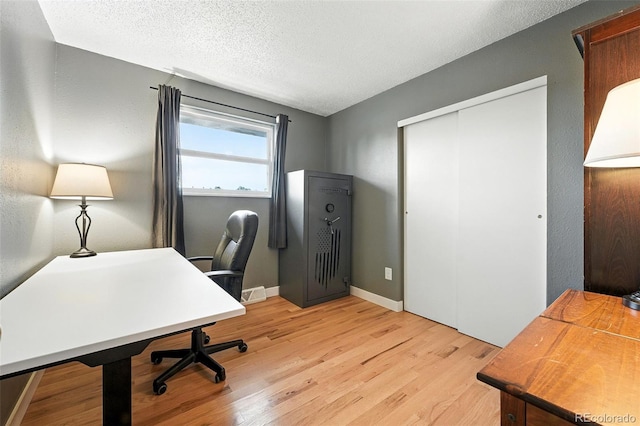 2011 S Vallejo St, Denver, CO 80223 - office featuring light wood finished floors and a textured ceiling