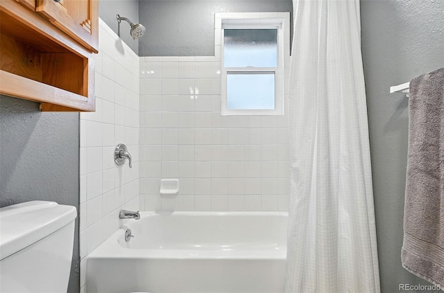 2011 S Vallejo St, Denver, CO 80223 - bathroom featuring a textured wall and shower / bath combo
