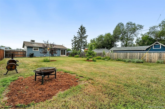 2011 S Vallejo St, Denver, CO 80223 - fenced backyard featuring a fire pit
