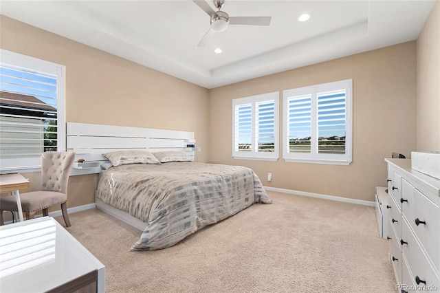 3278 Ghost Dance Dr, Castle Rock, CO 80108 - bedroom with light colored carpet, recessed lighting, a ceiling fan, and a tray ceiling