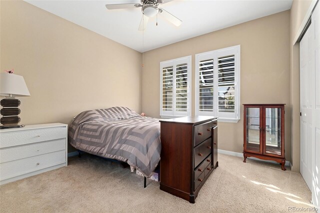 3278 Ghost Dance Dr, Castle Rock, CO 80108 - bedroom featuring a closet, light colored carpet, and ceiling fan