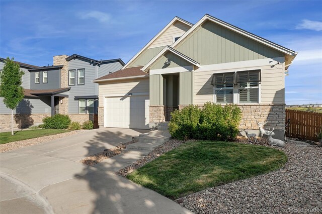 3278 Ghost Dance Dr, Castle Rock, CO 80108 - craftsman-style house featuring stone siding, a garage, and concrete driveway