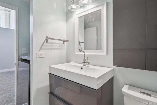 720 16th St Unit 306, Denver, CO 80202 - bathroom featuring vanity and toilet