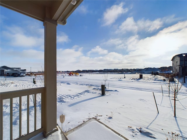 view of yard layered in snow