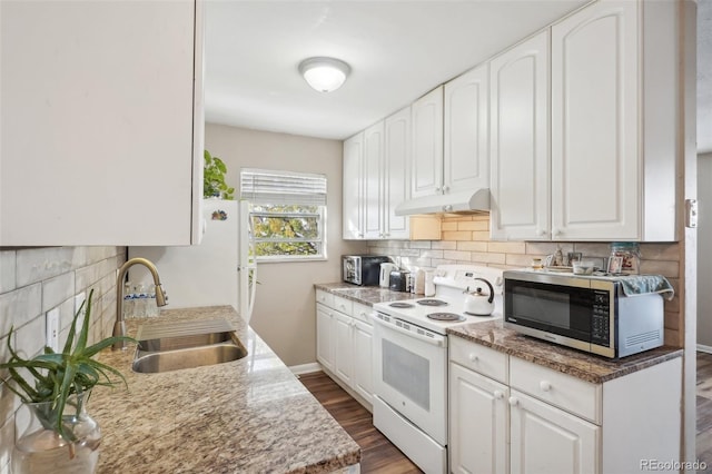 kitchen with white appliances, dark hardwood / wood-style floors, white cabinetry, and sink