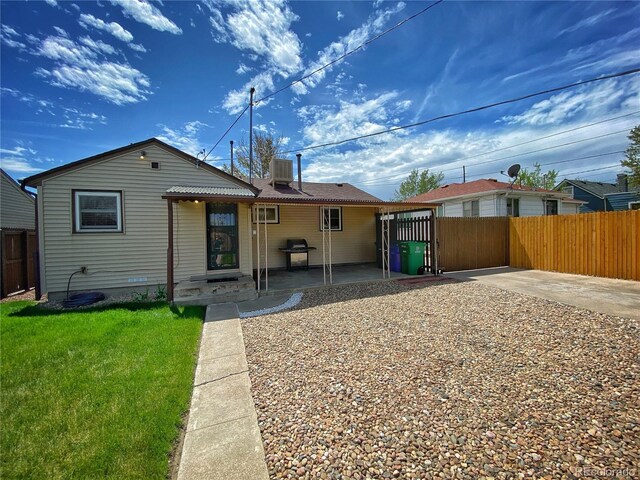 rear view of house featuring a patio and central AC unit