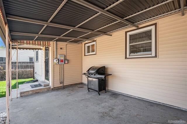 view of patio / terrace featuring a grill and fence