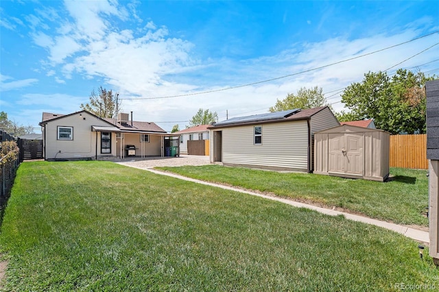2235 W 46th Ave, Denver, CO 80211 - back of property with a fenced backyard, a shed, and a patio