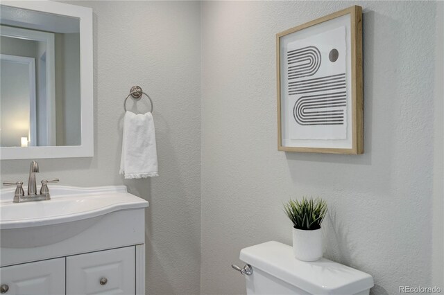 8652 Aberdeen Cir, Highlands Ranch, CO 80130 - bathroom featuring toilet and vanity