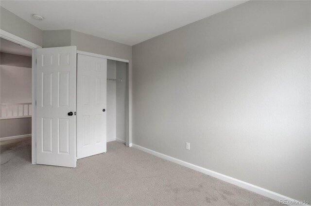 8652 Aberdeen Cir, Highlands Ranch, CO 80130 - unfurnished bedroom with light colored carpet, baseboards, and a closet