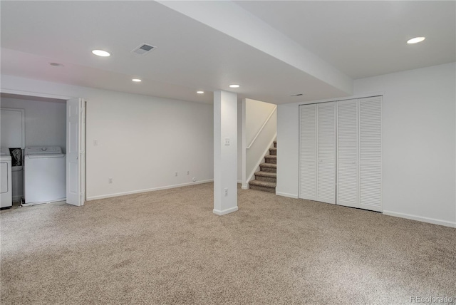 8652 Aberdeen Cir, Highlands Ranch, CO 80130 - finished below grade area with washing machine and dryer, light carpet, stairway, recessed lighting, and baseboards