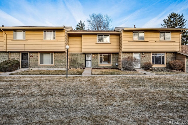 multi unit property featuring brick siding