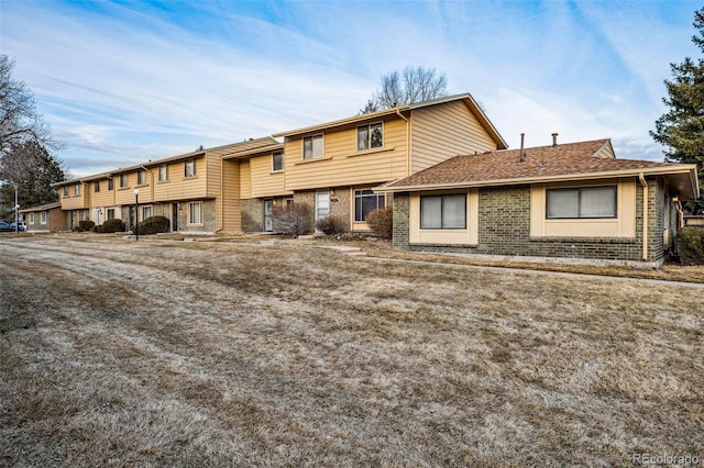 view of front of property featuring brick siding