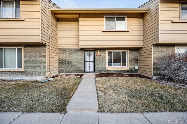 view of front of home with brick siding