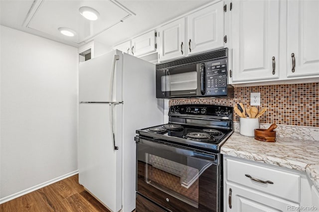 kitchen with baseboards, dark wood-type flooring, black appliances, white cabinetry, and backsplash