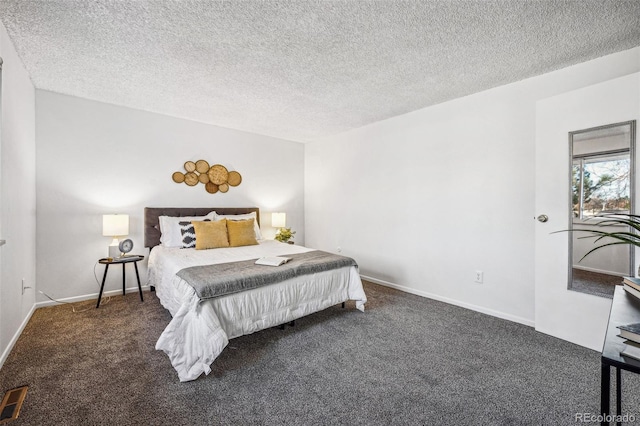 carpeted bedroom with visible vents, a textured ceiling, and baseboards