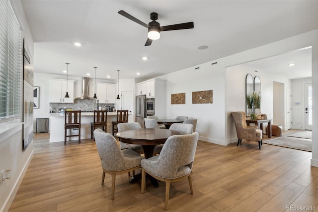 dining room with recessed lighting, baseboards, light wood finished floors, and ceiling fan