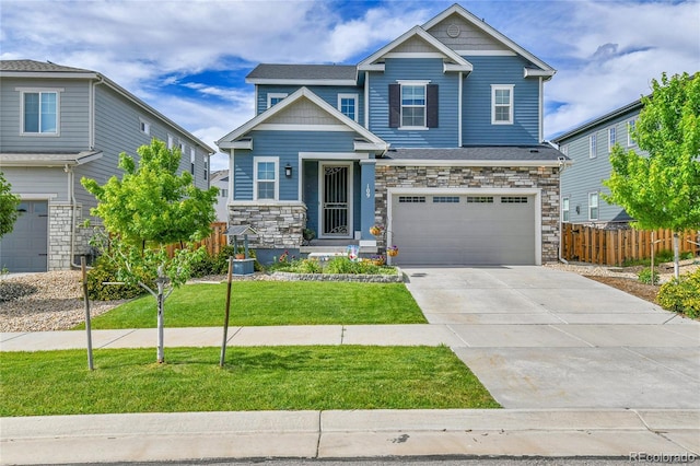 109 N Patsburg St, Aurora, CO 80018 - craftsman-style house with an attached garage, concrete driveway, and stone siding
