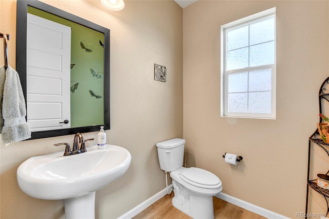 109 N Patsburg St, Aurora, CO 80018 - half bath featuring wood finished floors and baseboards