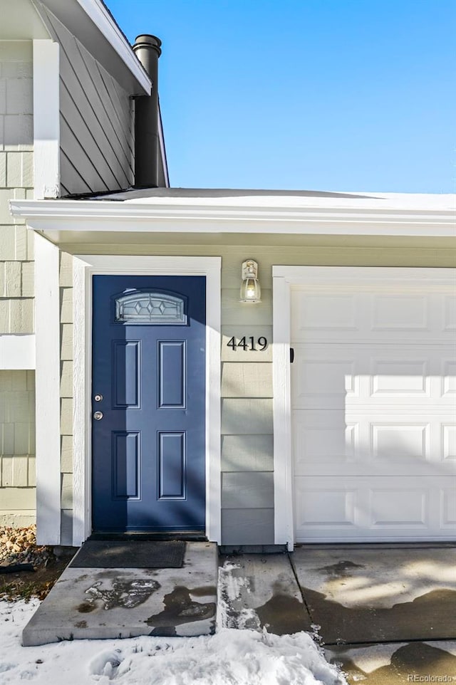 property entrance featuring a garage