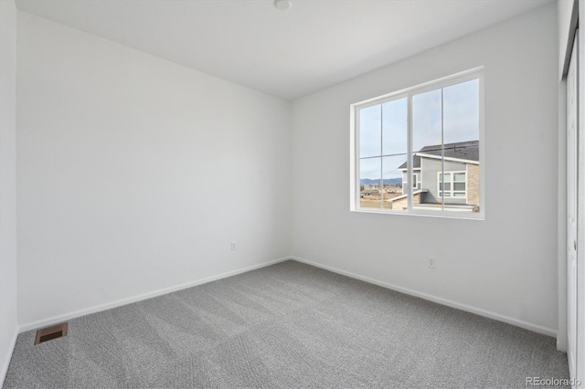 1242 Penner Dr, Erie, CO 80026 - carpeted spare room featuring baseboards and visible vents