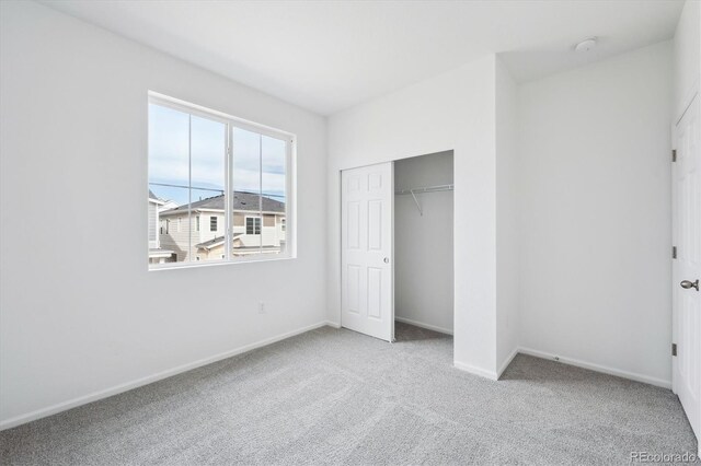 1242 Penner Dr, Erie, CO 80026 - unfurnished bedroom with baseboards, a closet, and carpet